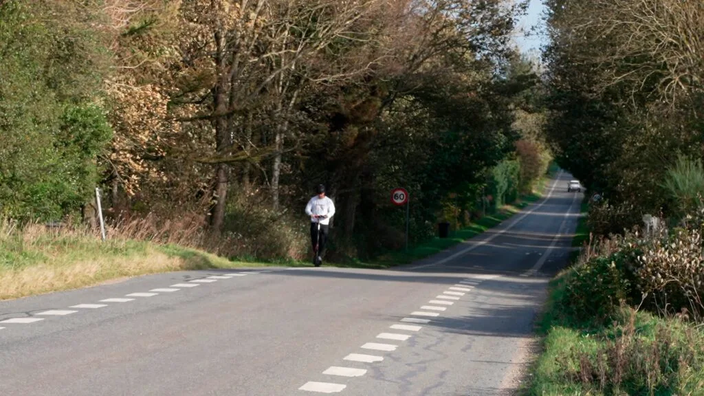 Riding an electric scooter up a steep hill