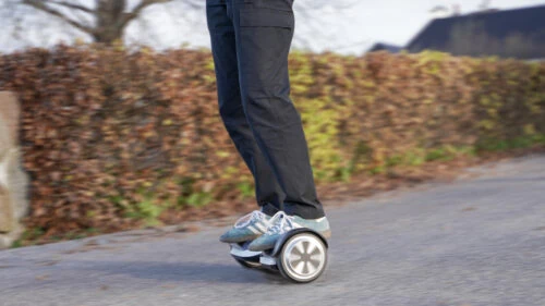 Riding fast on a hoverboard with motion blur in the background