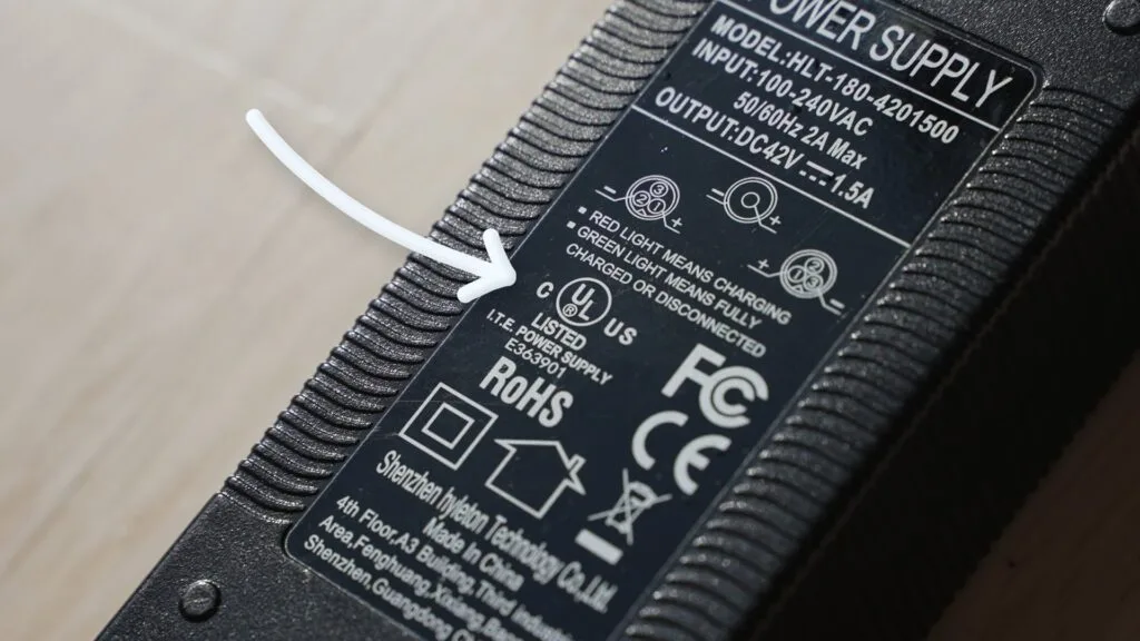 Arrow pointing to UL certification on a hoverboard charger