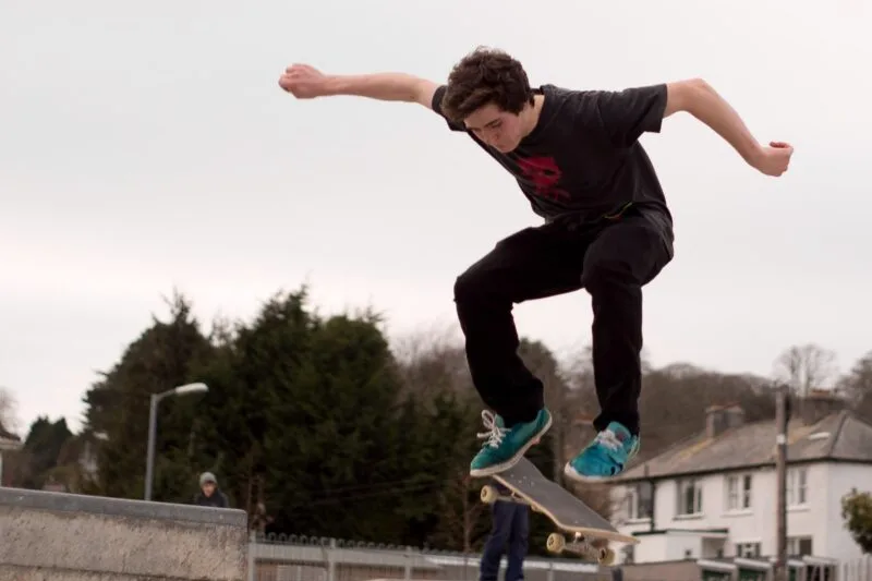 skateboarder doing a trick in a skate park
