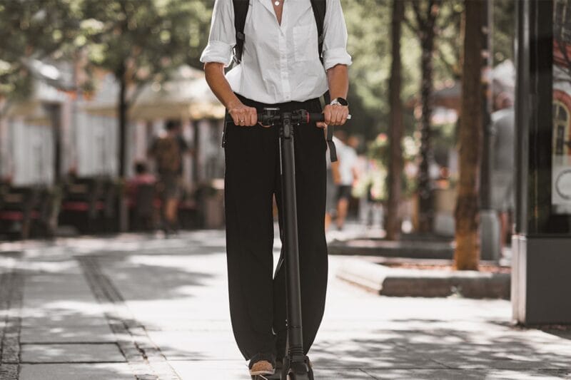 Woman Riding an Electric Scooter in The Park