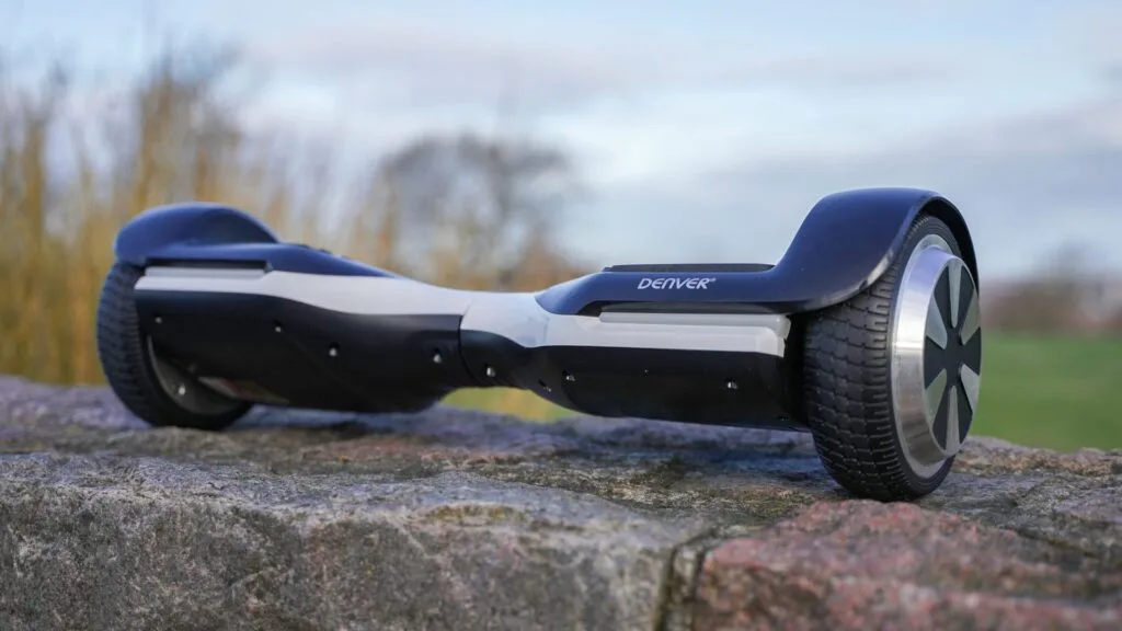 Close-up of a Denver hoverboard placed on a stone ledge with a blurred nature background