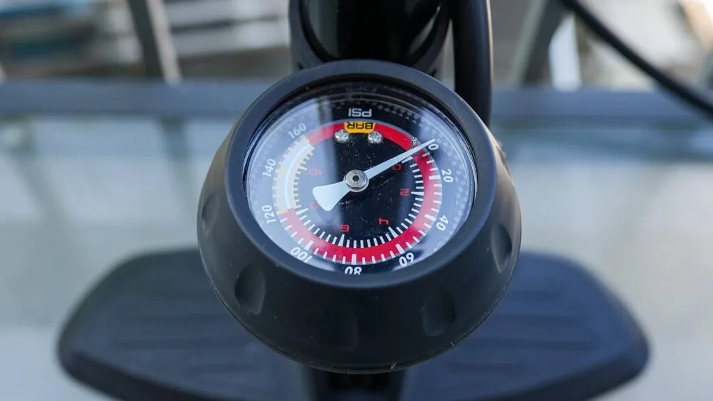 Close-up of a pressure gauge on a floor air pump
