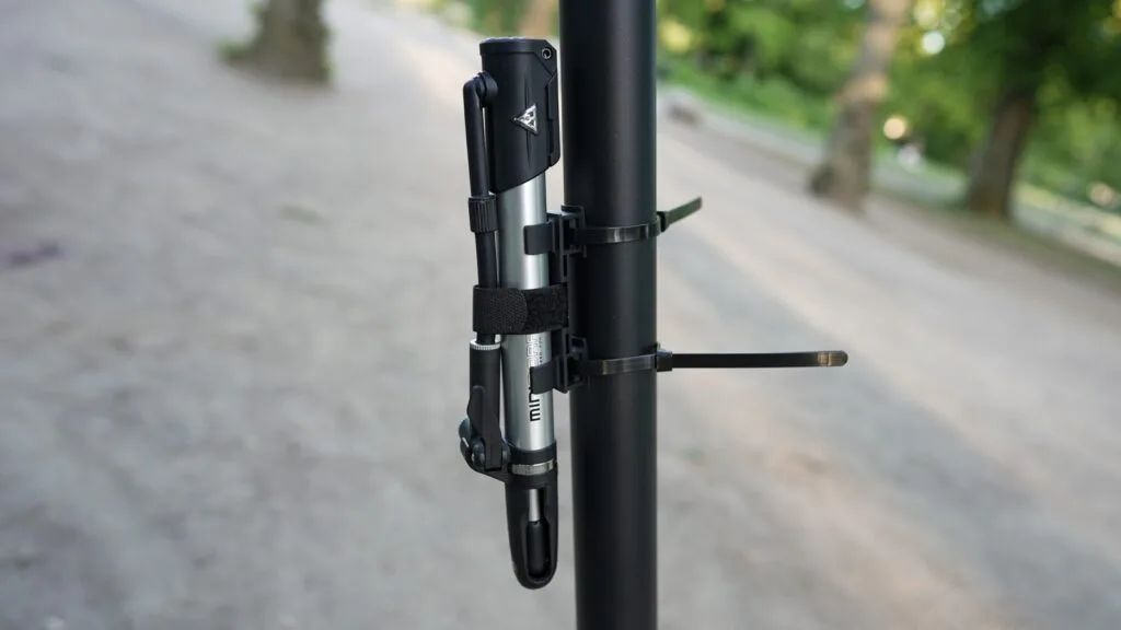 Topeak Mini morph pump mounted on the stem of an electric scooter