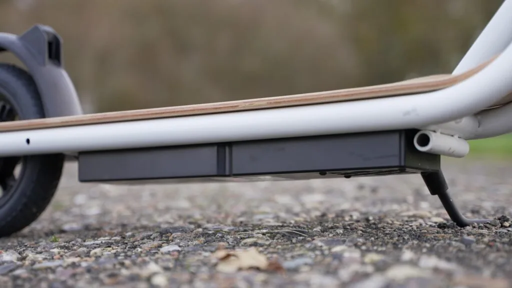 Photo closeup of the battery compartment at the bottom side of the deck on the Fluid CityRider