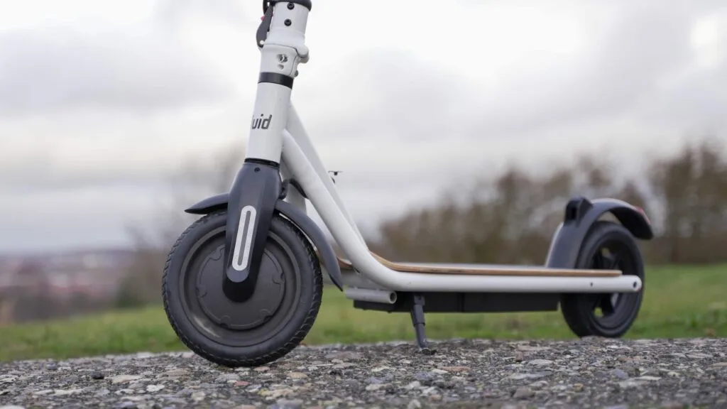 Photo of the FluidFreeRide CityRider electric scooter with the front wheel hub motor in focus