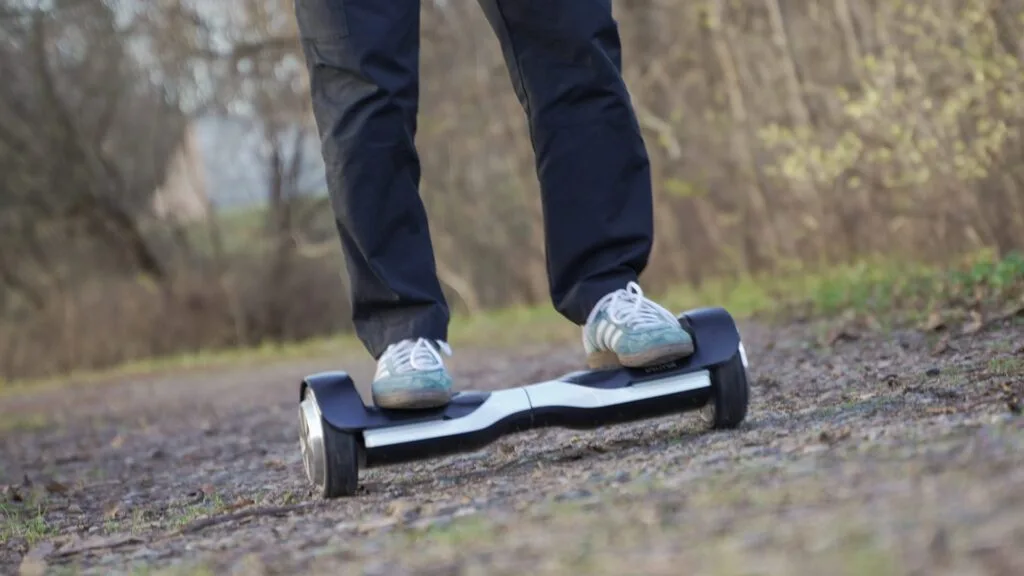 Riding a hoverboard on a forest trail