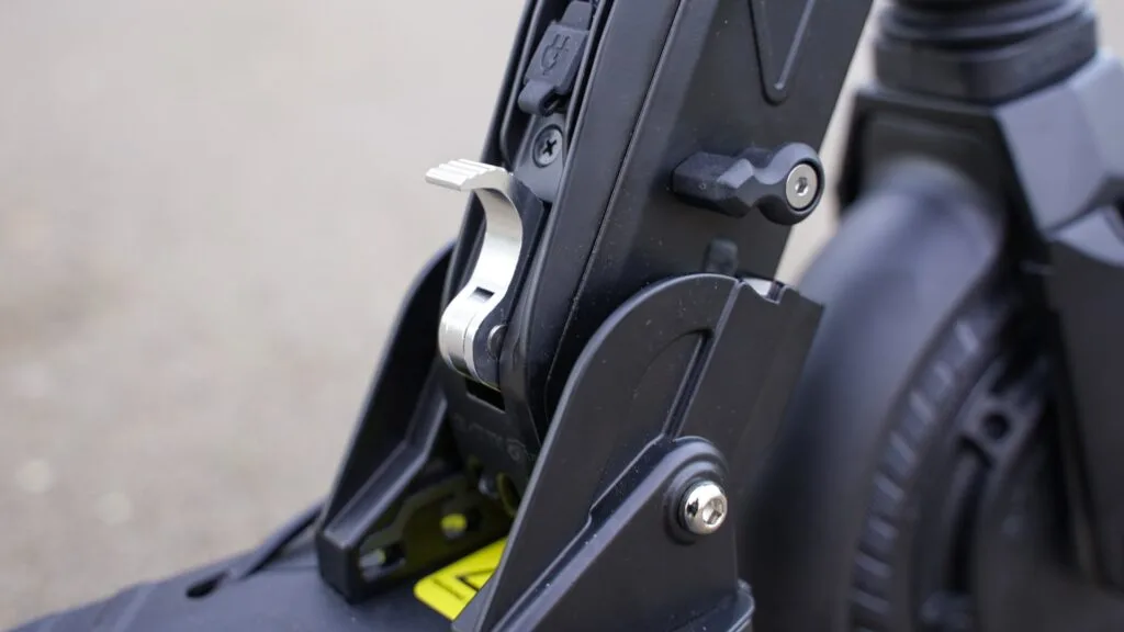 Close-up of the folding mechanism on the Fluid Free Ride Mosquito electric scooter
