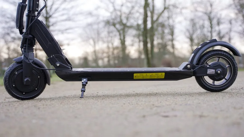 Low-angled photo of the Fluid Mosquito with the deck and ground in focus to show the ground clearance