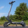 Nanrobot N6 72V electric scooter positioned on a patch of asphalt with blue sky and trees in the background