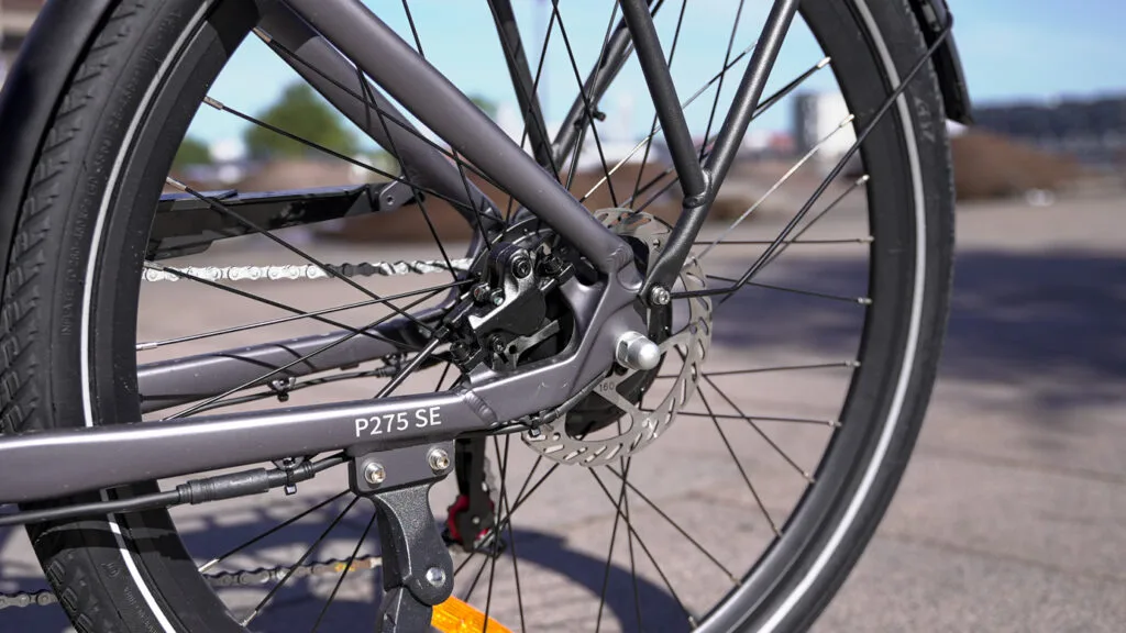engwe p275se close up of rear disc brake near building