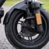 Close-up of the VMAX VX2 Lite front drum brake, hydraulic fork and 10-inch tubeless tire