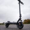 VMAX VX2 Lite electric scooter standing upright, low-angle front three-quarter view