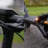 VMAX VX2 Lite headlight next to the lit rear turn signal and brake light